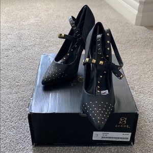Women’s black and gold studded heels